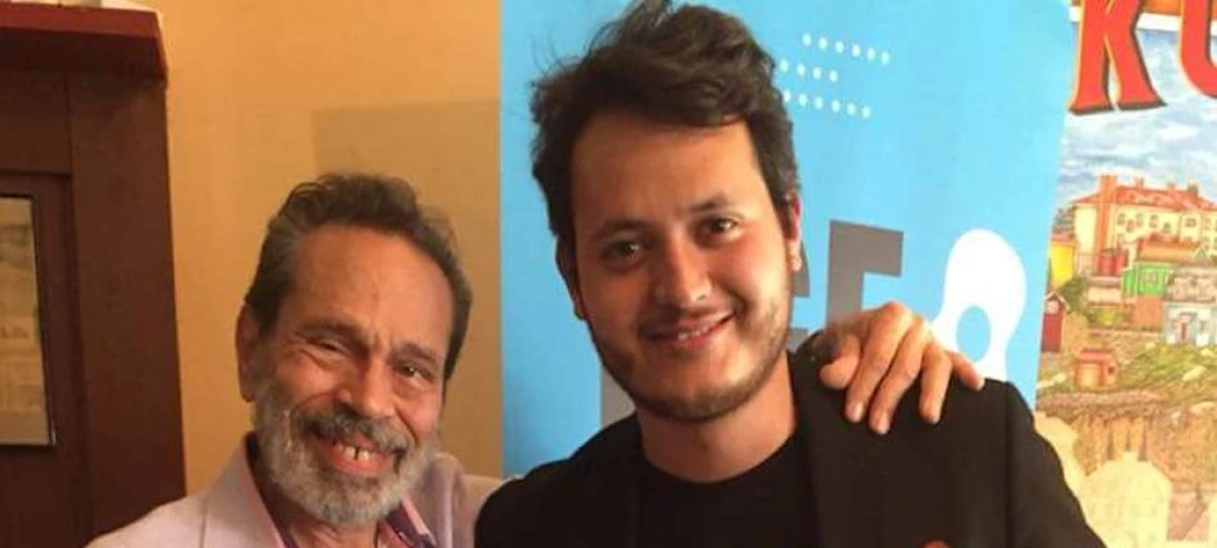 Misael Barraza-Diaz with composer Leo Brouwer after winning first prize in the First International Classical Guitar Competition of Finland the holding the prize guitar built by Finnish luthier,  Keijo Korelin